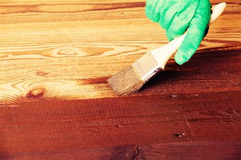 Is it better to brush or wipe on stain?