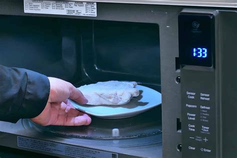 Is it better to defrost chicken in the microwave or water?