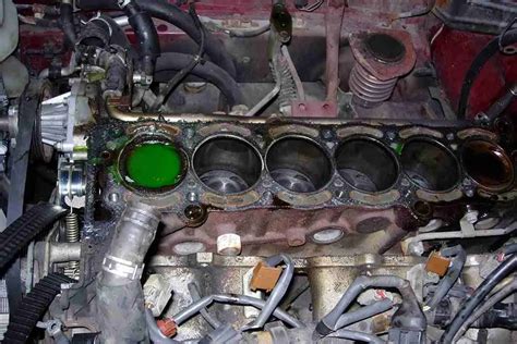 Is it better to fix a blown head gasket or replace engine?