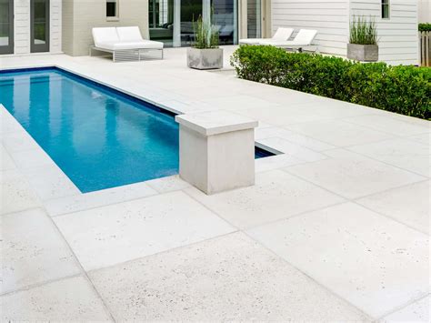 Is it better to have pavers or concrete around a pool?