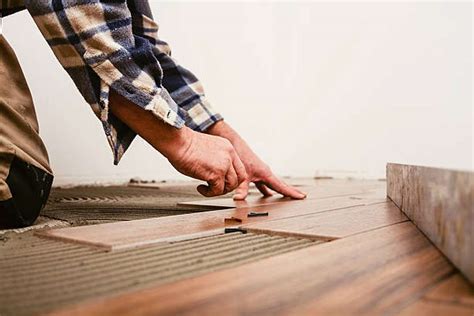 Is it cheaper to install tile or laminate?
