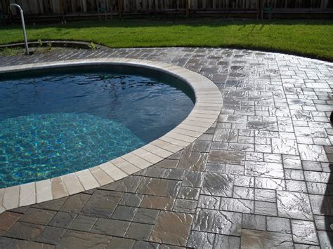 Is it cheaper to put concrete or pavers around a pool?