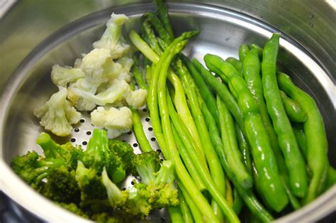 Is it healthier to steam or boil vegetables?