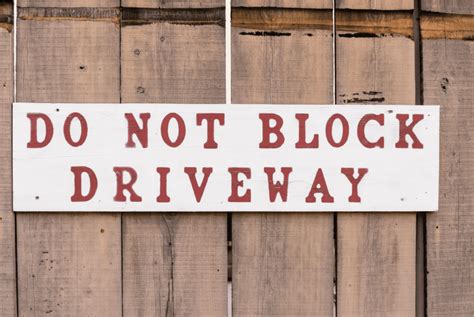 Is it illegal to block your own driveway in Texas?