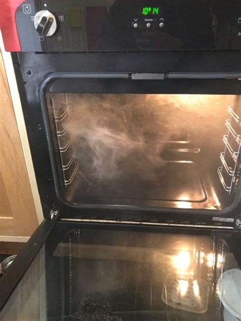 Is it normal for electric oven to smoke?