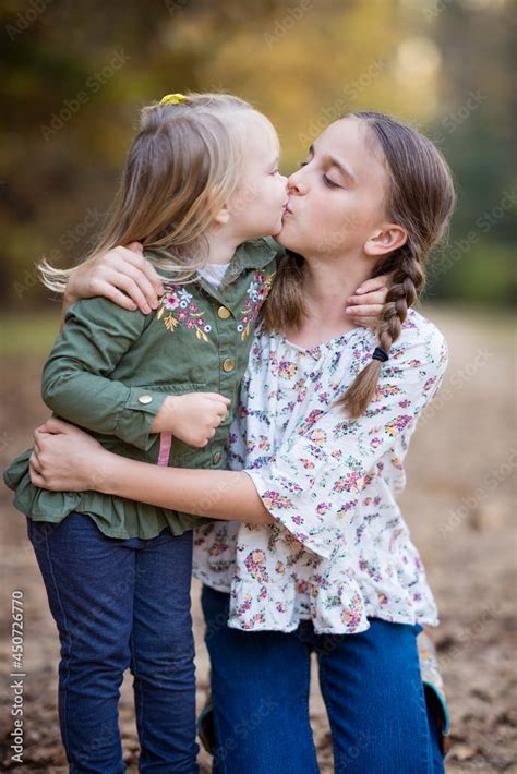 Is it normal for sisters to kiss?