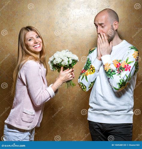 Is it okay for a girl to give a guy flowers?