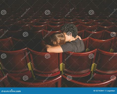 Is it okay to kiss in a theatre?