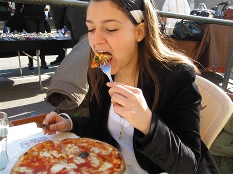 Is it rude to eat pizza with your hands?