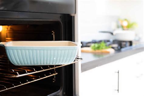 Is it safe to cook in a new oven that smell?