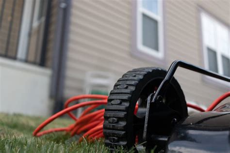 Is it safe to store a lawn mower battery in the house?