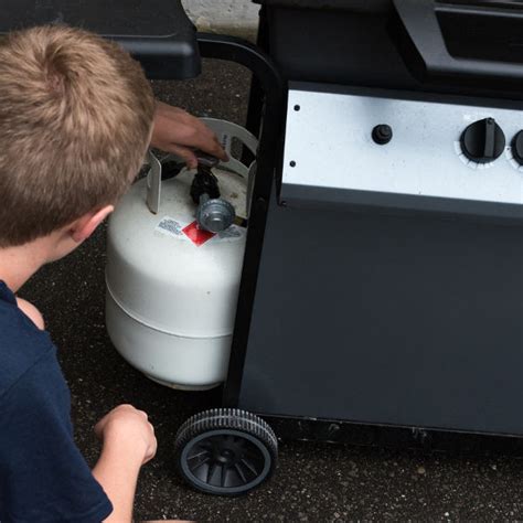 Is it safe to store propane tank under grill?