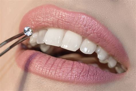 Is it safe to use nail glue for tooth gems?