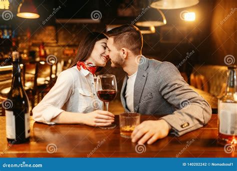 Is kissing OK at a bar?