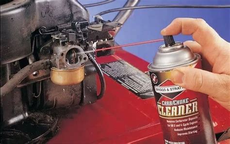 Is there a way to clean a lawn mower carburetor with without removing it?