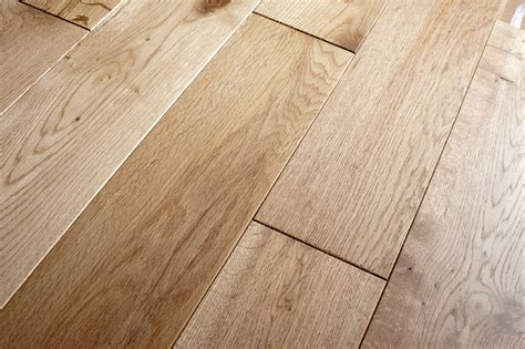 Is wood floor warmer than laminate?