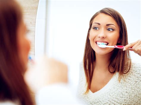 Should I brush my teeth after extraction?
