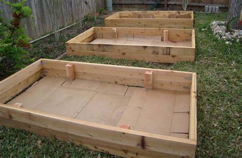 Should I put cardboard in the bottom of my raised beds?