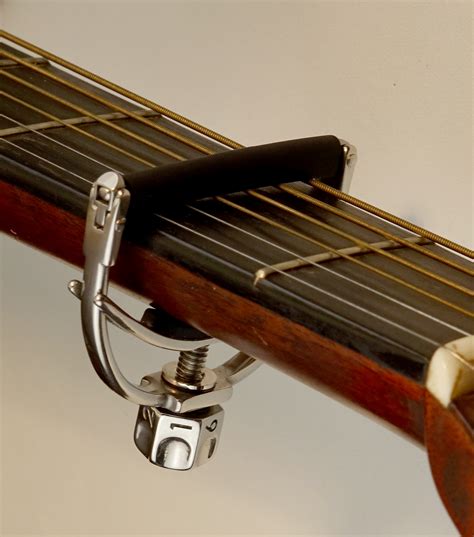 Should I tune guitar after capo?