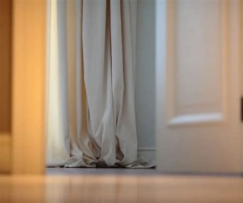 Should curtains puddle on the floor?