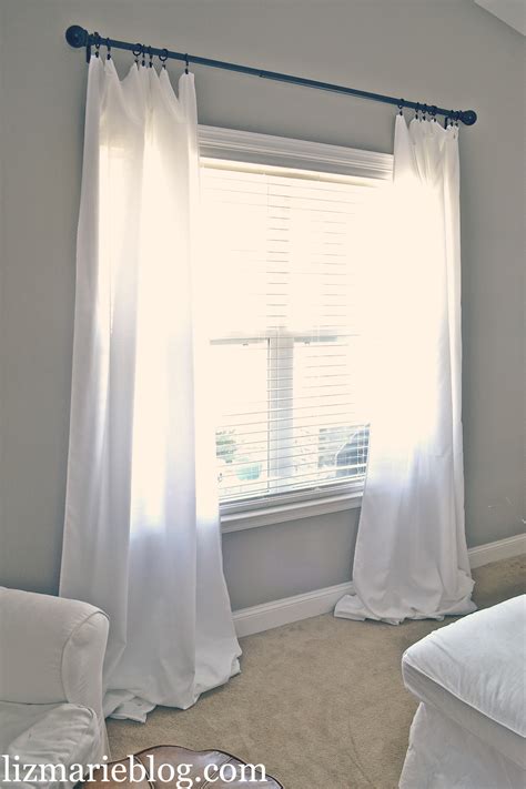 Should curtains touch the floor or ceiling?