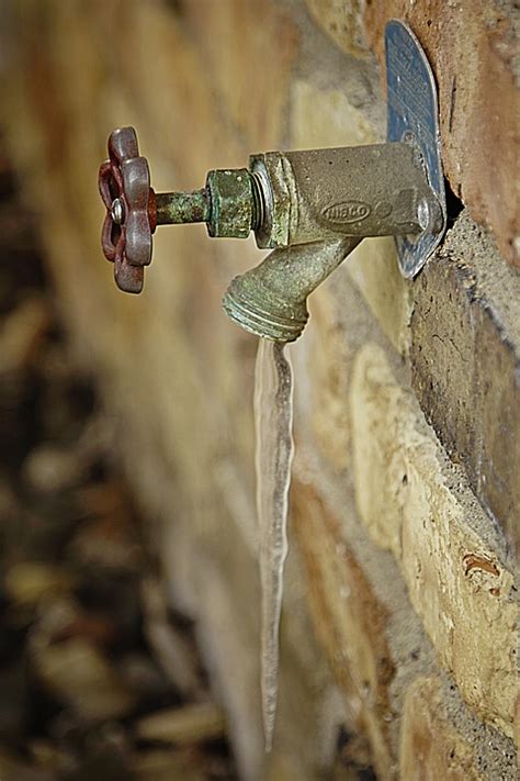 Should outside faucets be left open or closed in winter?