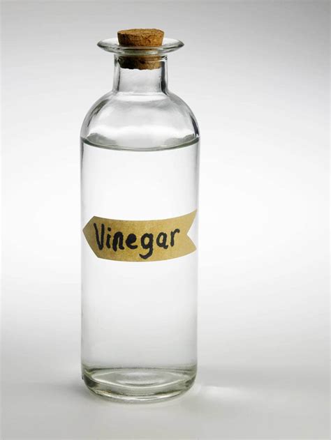 Should vinegar be stored in glass or plastic?