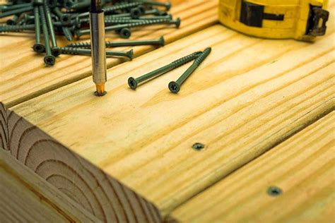 Should you nail or screw deck boards?