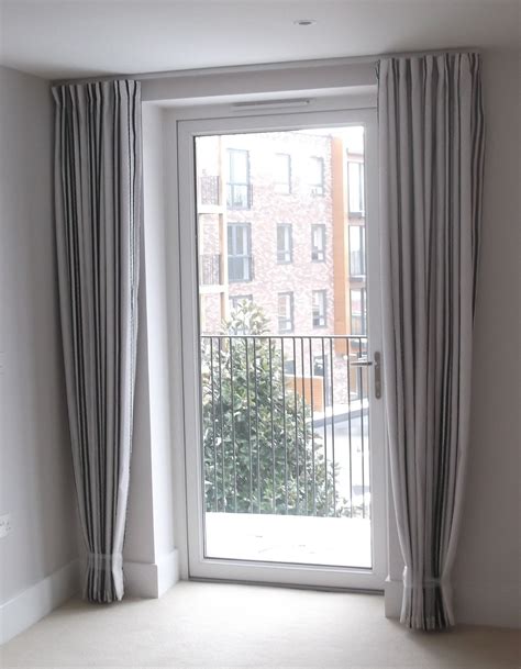 Should you put curtains on floor to ceiling windows?