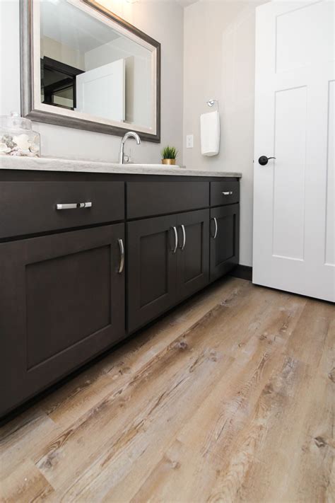 What are three qualities of a good bathroom floor?