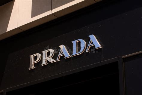 What brand owns Prada?
