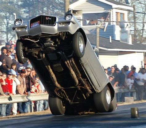 What causes a car to do a wheelie?