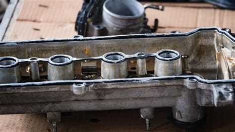 What causes a valve cover to crack?