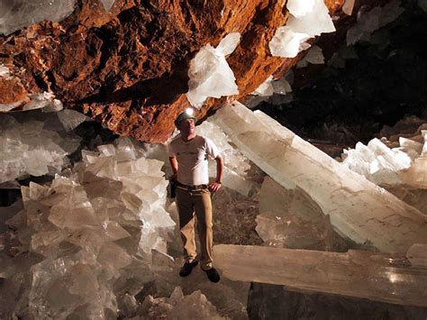 What causes crystals in caves?