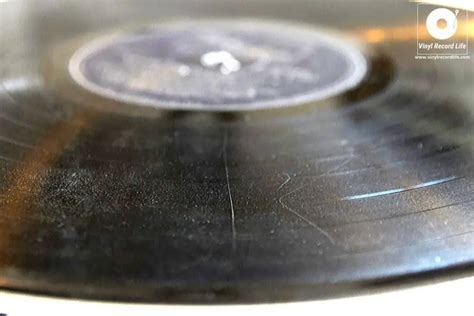 What causes vinyls to scratch?