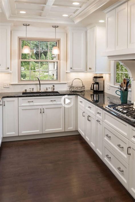 What color floor with white cabinets and black countertops?