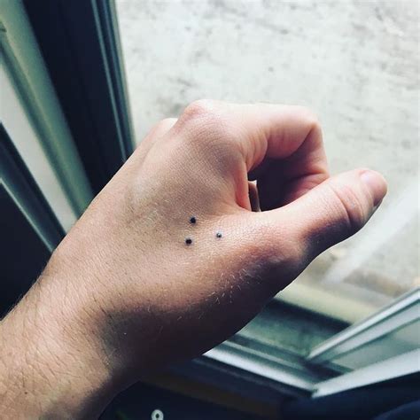 What do 3 dots mean tattoo?
