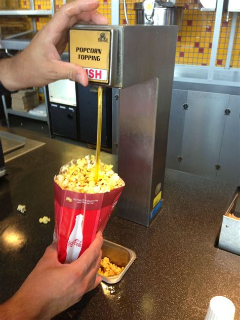 What do movie theaters squirt on popcorn?