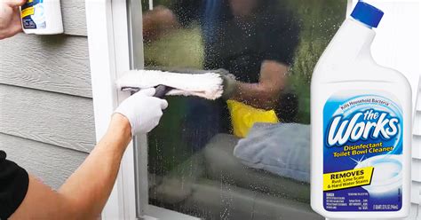 What do professional window cleaners use on hard water stains?