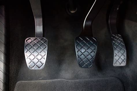 What do the 3 pedals in a car do?