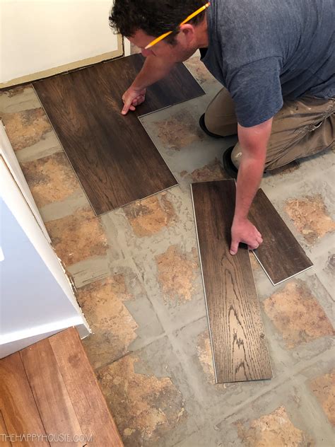 What do you put between laminate and tile?