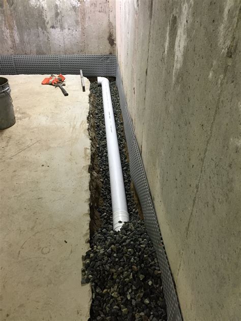 What does a basement French drain look like?