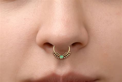 What does a nose piercing Symbolise?