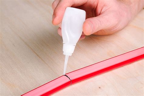 What glue holds plastic together?