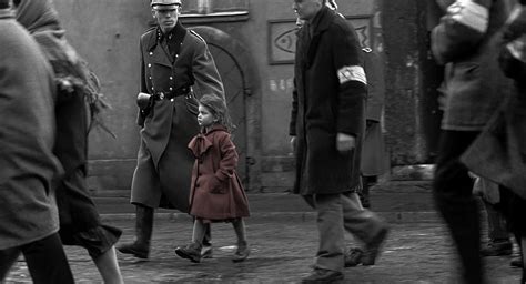 What happened to the girl in the red dress in Schindler's List?