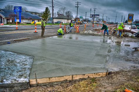 What happens if it rains 4 hours after pouring concrete?