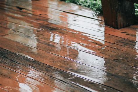 What happens if it rains after staining concrete?