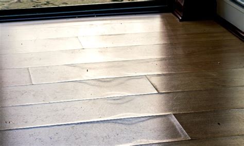 What happens if water gets under laminate flooring?