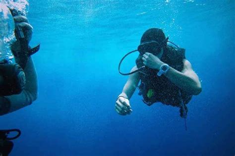 What happens if you cough while scuba diving?