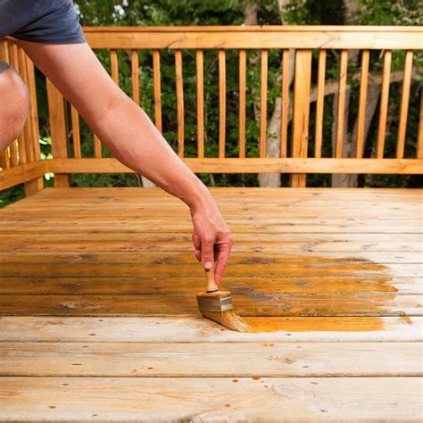 What happens if you stain pressure treated wood too soon?